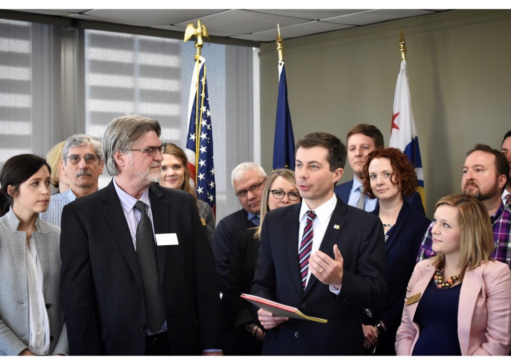 Mayor Pete Buttigieg and other officials announcing partnership