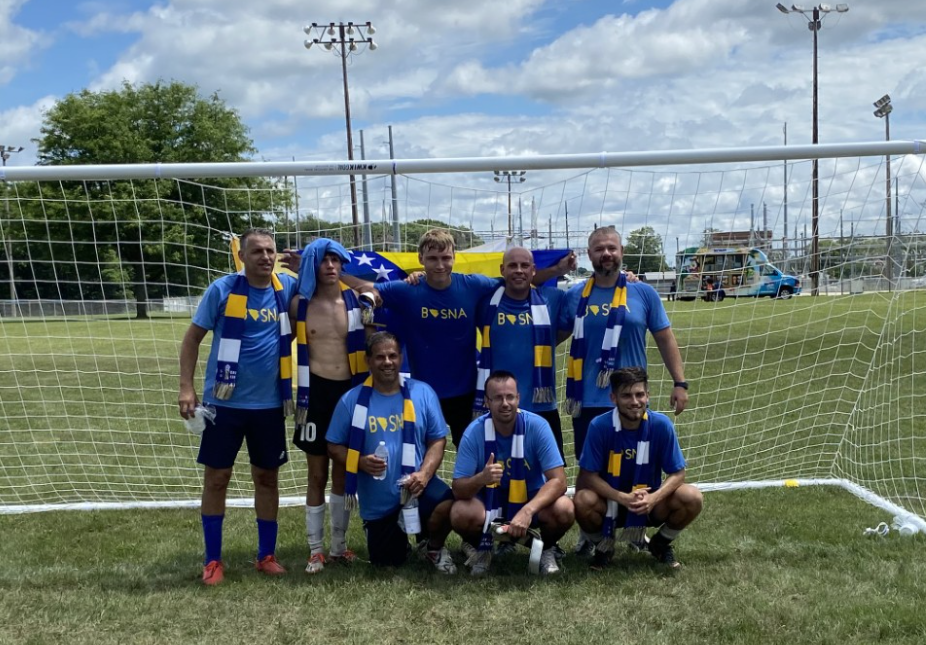 Team Bosna poses in front of the soccer net.