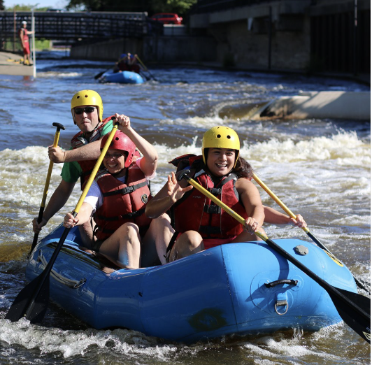 City employees raft on the East Race during a City wellness
event